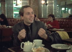 full-moon-in-paris-1984-001-fabrice-luchini-clenching-fists-delightedly-in-cafe_0